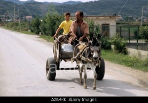 Father and son on their way to market near Tirana Albania